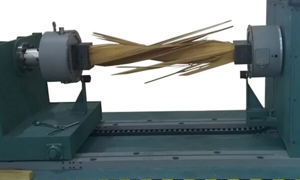 Machine creating wooden stick for Torsion Testing purposes.